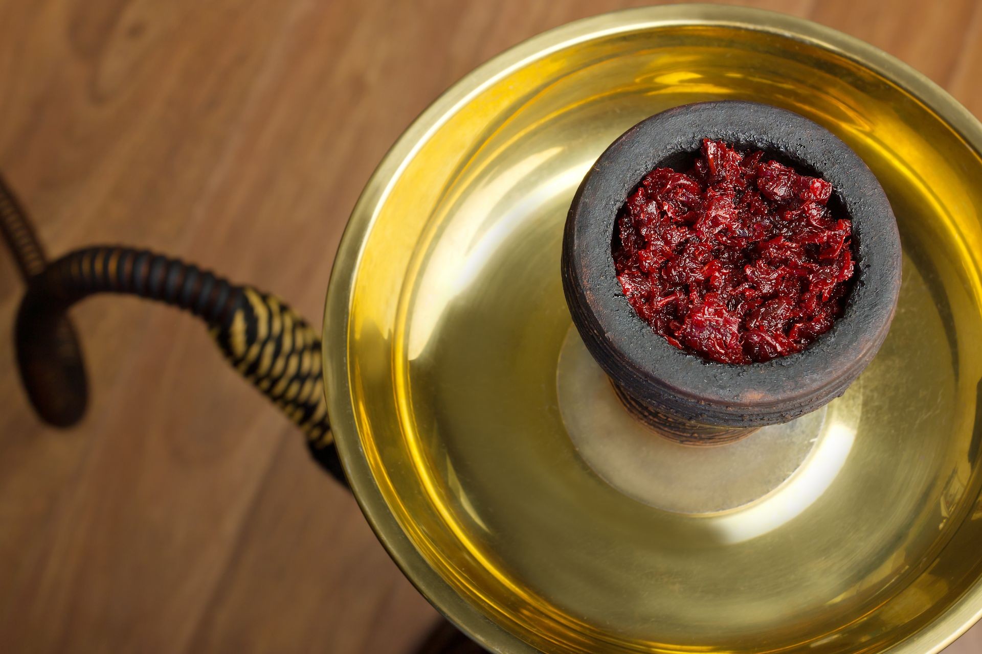 preparation of hookah,fruit-flavoured tobacco in the bowl of a shisha